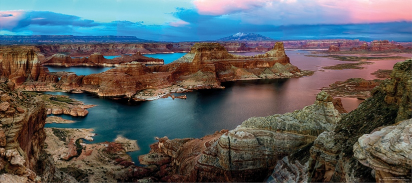 Deep blue Lake Powell among sandstone mesas and coves viewed from Alstrom Point